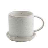 Kleine Tasse mit Untersetzer - weiß gesprenkelt