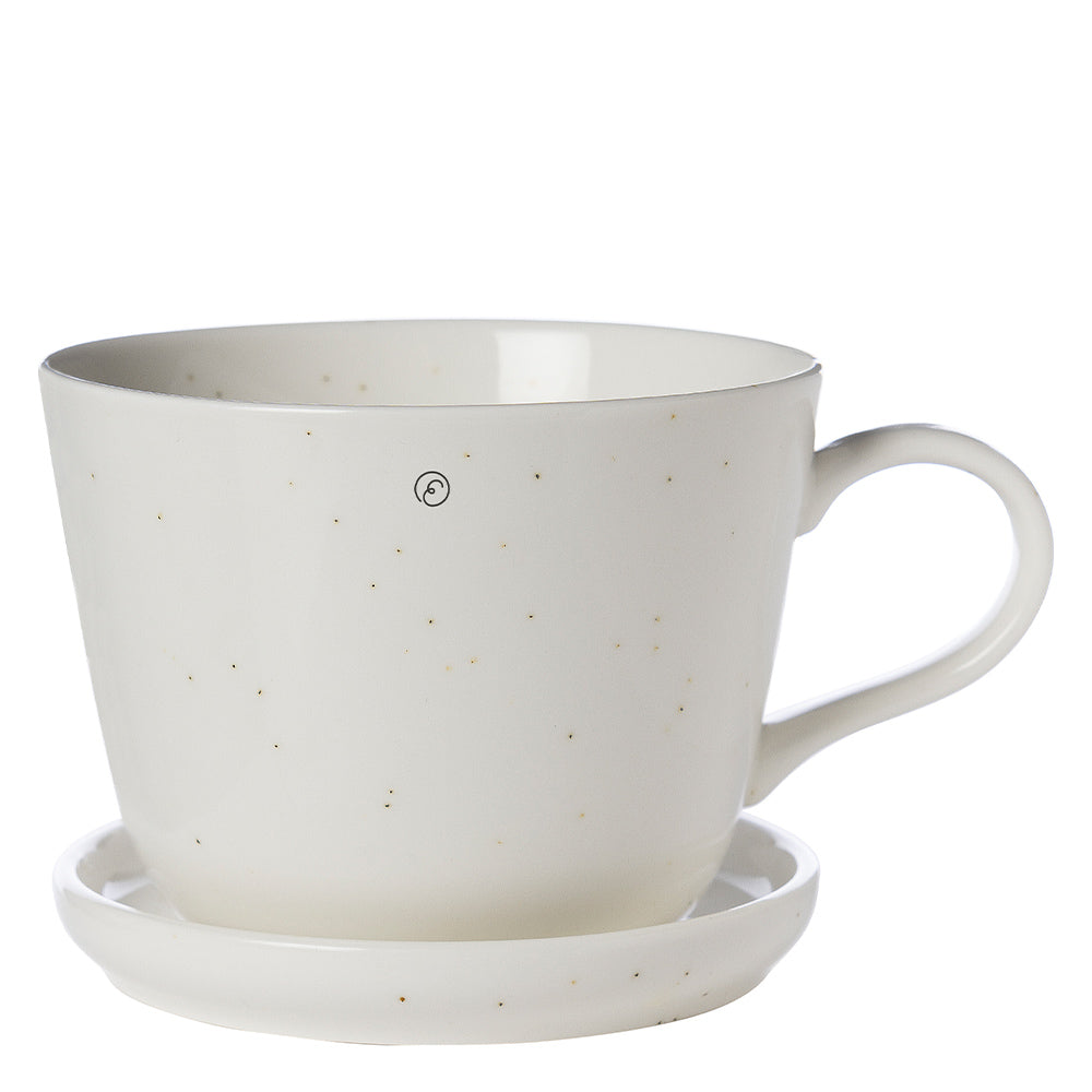 Frontansicht der vanillefarbenen Kaffeetasse mit Untersetzer aus Porzellan von ERNST, 200 ml