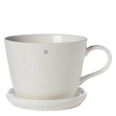 Frontansicht der vanillefarbenen Kaffeetasse mit Untersetzer aus Porzellan von ERNST, 200 ml